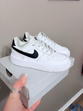 Nike Kids White Sneakers with Black Swoosh